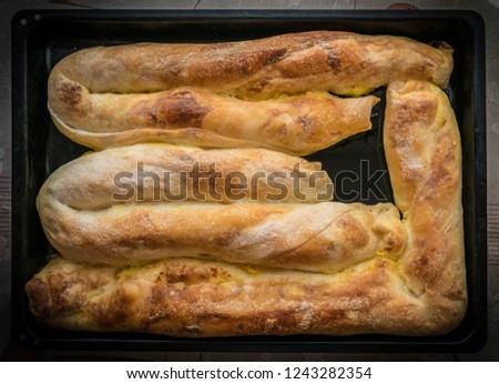 Tasty pie is ready to serve. Serbian domestic pie with cheese and eggs.  Royalty-Free Stock Photo #1243282354
