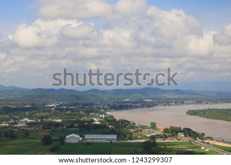small city and big river with sky and clouds background