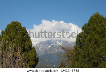 Beautiful clouds above mountains on a winter day. This photo was taken on a trip to palampur himachal pradesh, the city famous for their landscapes, scenes, movies shoot locations.