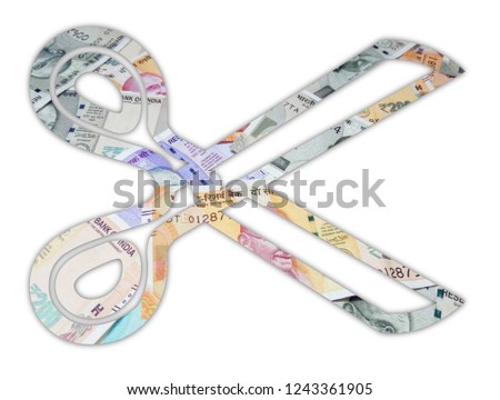 Indian Currency Notes cut in the shape of Scissor isolated on white background