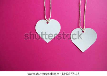 Two hearts on pink background, love and Saint Valentine day concept. Wedding celebration.