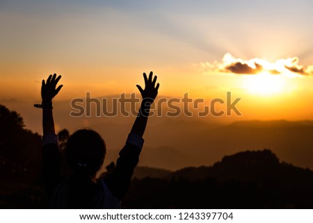 Christian religion concept background. Silhouette Human hands open palm up worship background. 