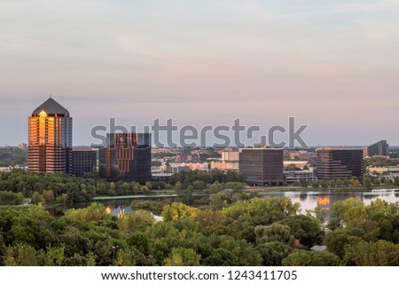 A Medium Shot of the Lake Normandale  Office Block Reflecting a Late Summer Sunset in Bloomington, Minnesota Royalty-Free Stock Photo #1243411705