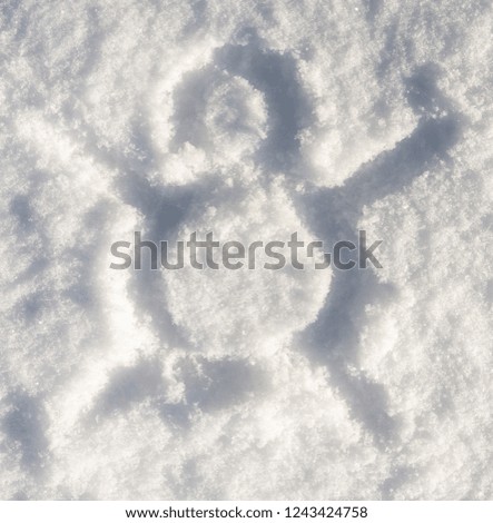 snowman drawing on white snow