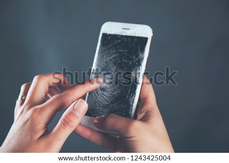 woman  touching broken phone