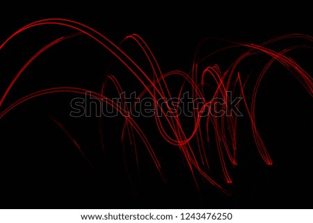 Abstract red light from moving lamp night photography