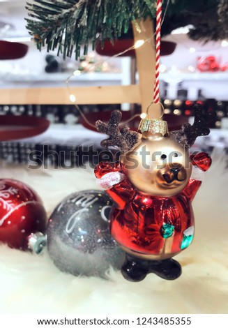 Santa’s deer on a Christmas tree creates a festive mood in the house on the eve of Christmas
