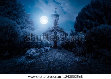 Scary view of church and spooky cloudy sky with moon, Horror Halloween concept