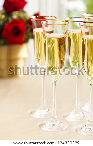 Wedding reception setting with champagne and flowers