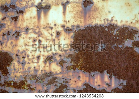 Old cracked abstract grunge vintage texture copy space sunny background, retro pattern. White irregular spots paint peeling of brown concrete or wooden wall or ceiling flat surface.