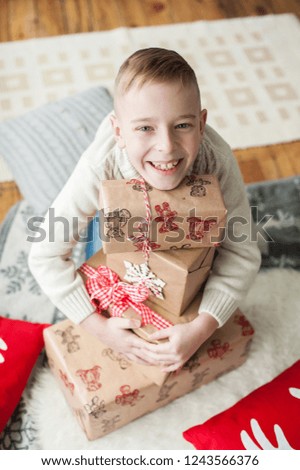 christmas boy boy photo blond with a bunch of gifts