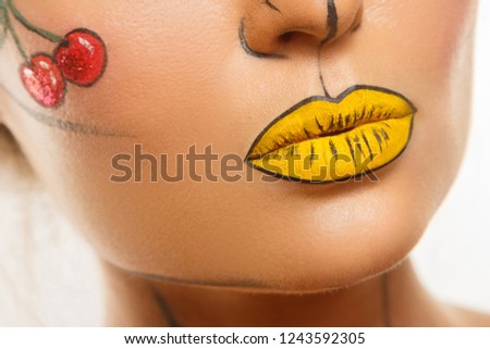 Close up of female lips with creative pop art makeup 