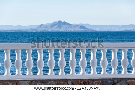 View at sea and mountain with balustrade