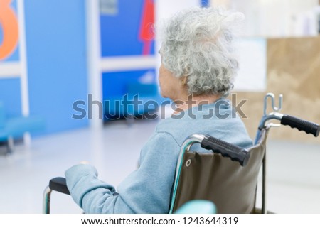 Elder patient woman on wheelchair waiting doctor in hospital