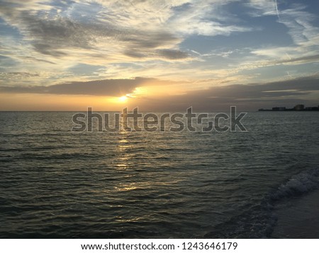 Sunrise on the beach and beautiful cloudscape over the sea