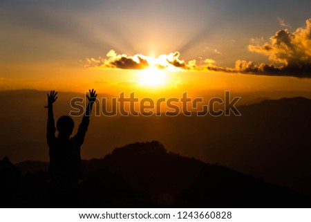 Christian religion concept background. Silhouette Human hands open palm up worship background. 