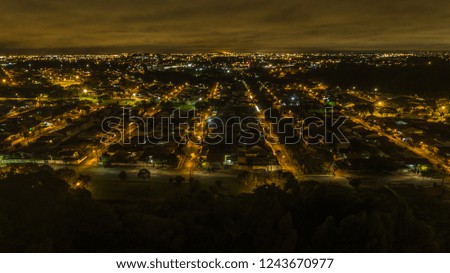 curitiba city in brazil at night, at midnight photographed by drone in long exposure, of the nightlife of the city.
