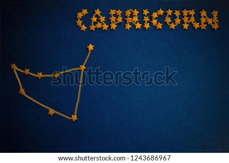 Horoscope for those born in January, astrological forecast. Zodiac sign, the constellation Capricorn. Top view, blue background. 