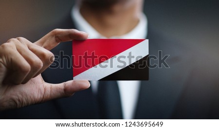 Businessman Holding Card of Principality of Sealand Flag