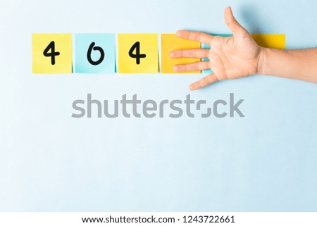 404 error not found message. Collection of different colored sticky note papers with curled corner, open palm hand hidden three notes and empty three notes.