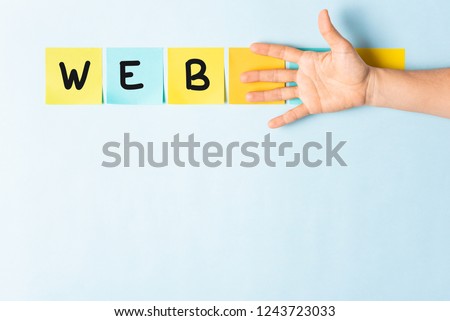 Banner web word concept. Collection of different colored sticky note papers with curled corner, open palm hand hidden three notes and empty three notes.