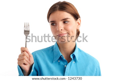 Stock photo of a young woman holding a fork