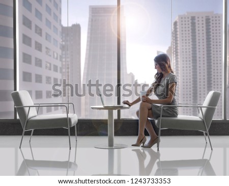 Clean modern business person, future concept, globally connected online, skyscrapers in background