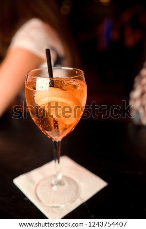 Classic Manhattan alcoholic cocktail served in a glass with a slice of orange peel