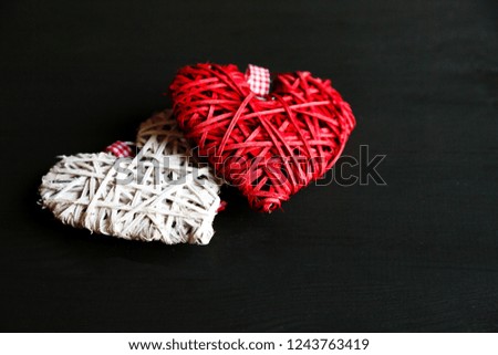 two hearts on black wooden table. Valentines, spring background. Mock up with copyspace. happy mothers day, romantic still life, 
