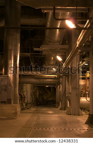 An assortment of different size and shaped pipes at a power plant