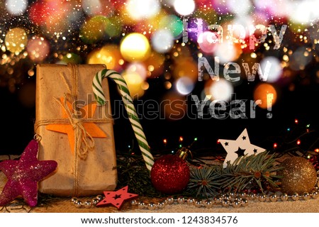  beautiful new year background with Christmas toys and fir twigs on a shiny background