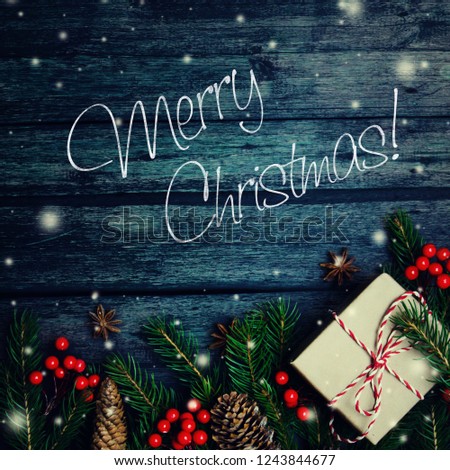 Christmas or New Year dark background, Xmas black board framed with season decorations, space for a text, view from above.