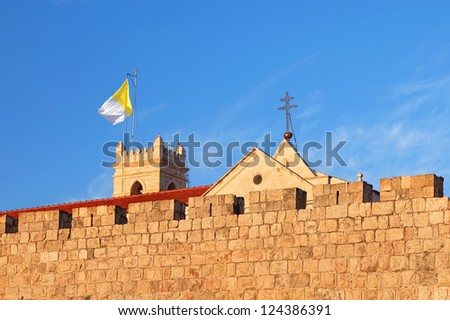 Flag of the Vatican on a tower of Latin residence in the Old City of Jerusalem (Israel)