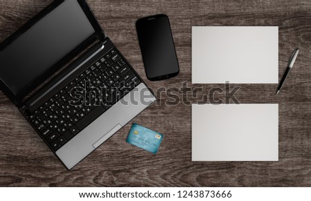 workplace concept with digital device, credit card and photograpy picture, top above