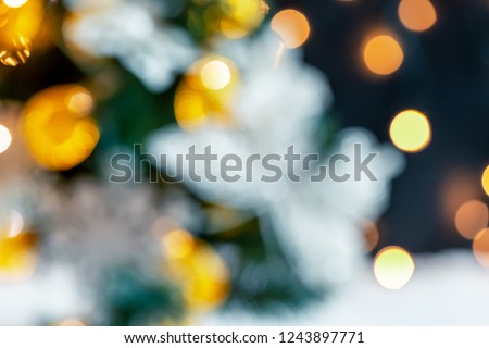 Christmas light background. Holiday glowing backdrop. Defocused background with blurred bokeh.