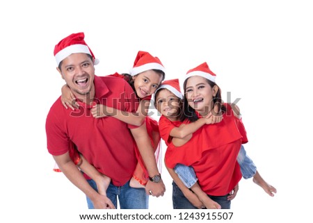 portrait of happy asian family wearing red christmas. isolated over white background