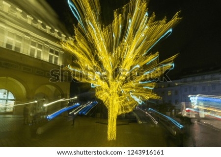 A shiny Christmas tree at night