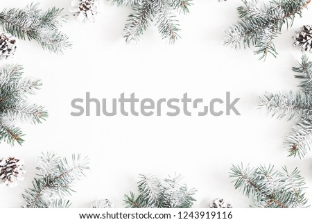 Christmas composition. Frame made of fir tree branches, pine cones on white background. Christmas, winter, new year concept. Flat lay, top view, copy space