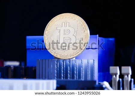 Picture of virtual currency, bitcoin and processor on blue background