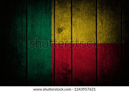 Benin flag
on a wooden background