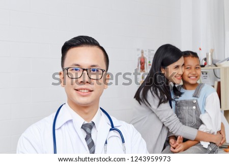 Doctor with medical clinic background for nursing care professional and patient trust in hospital's hospitality concept, Mother and Asian daughter come to the doctor.