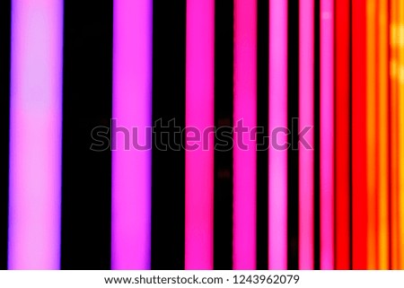 Neon pink and red shiny lines abstract background.
