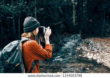 woman tourist photographs nature             