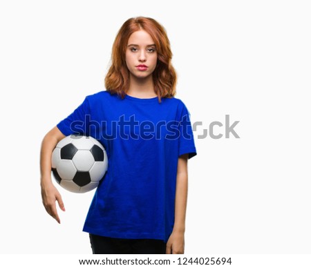 Young beautiful woman over isolated background holding soccer football ball with a confident expression on smart face thinking serious