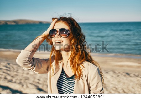  woman near the sea and sunglasses                              