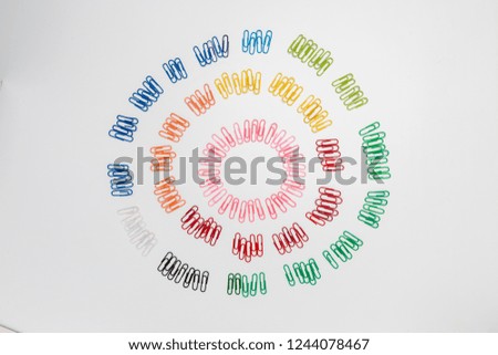 Multi-colored spiral figure made from paper clips isolated on white background.top view.