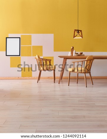 Modern and different style yellow room. Wooden object interior table and chair with wooden lamp decor. Carpet detail.