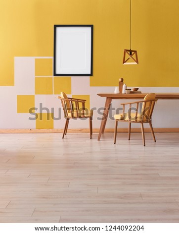 Decorative yellow wall, colorful armchair white coffee table. Wooden table and chair with wooden lamp style interior.