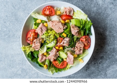 Tuna Fish Salad with Lettuce, Cherry Tomatoes, Cucumber and Corn. Royalty-Free Stock Photo #1244098966