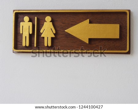 Man and lady Wooden toilet sign on white wall background.